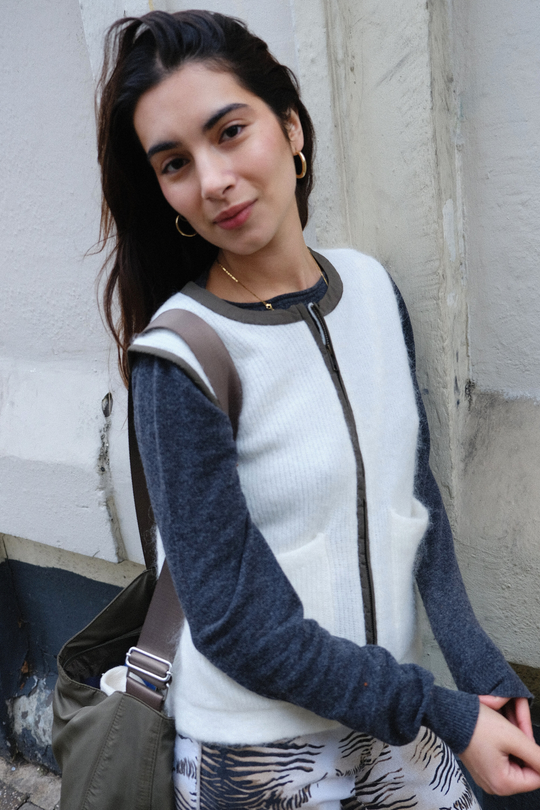 cream mohair gilet with green goretex zip worn by a size UK 8 girl in London