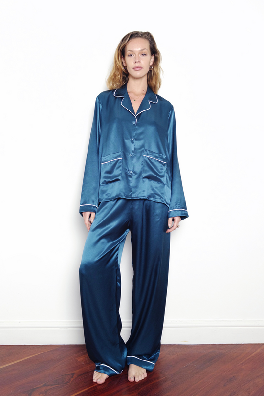 blue silk pyjamas with white pipping, worn in London