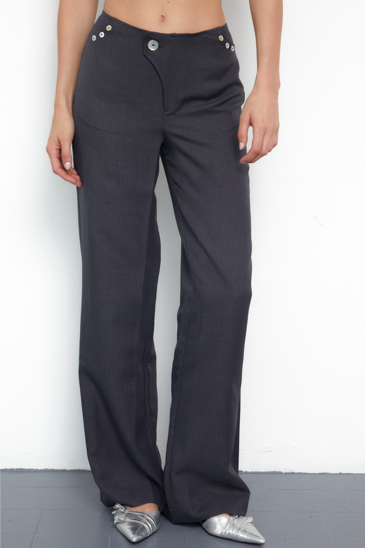 Dark grey tailored straight-leg trousers with button detail front view