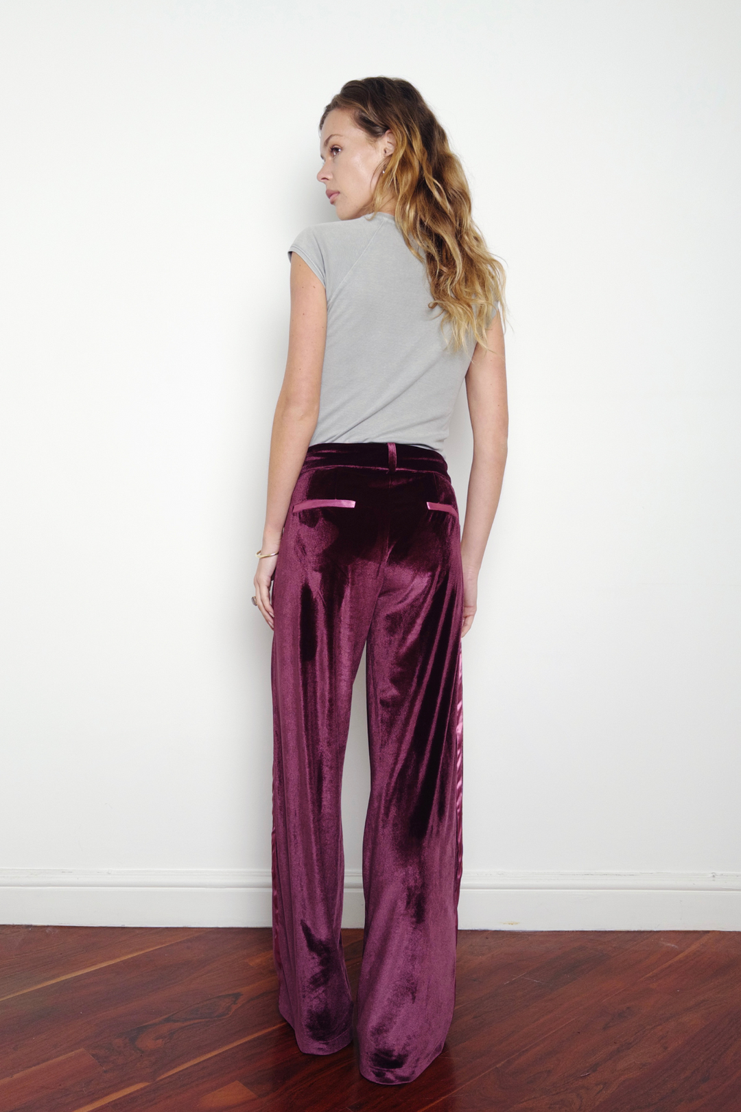 UK 8 model wearing size M in the purple velvet wide-leg trousers