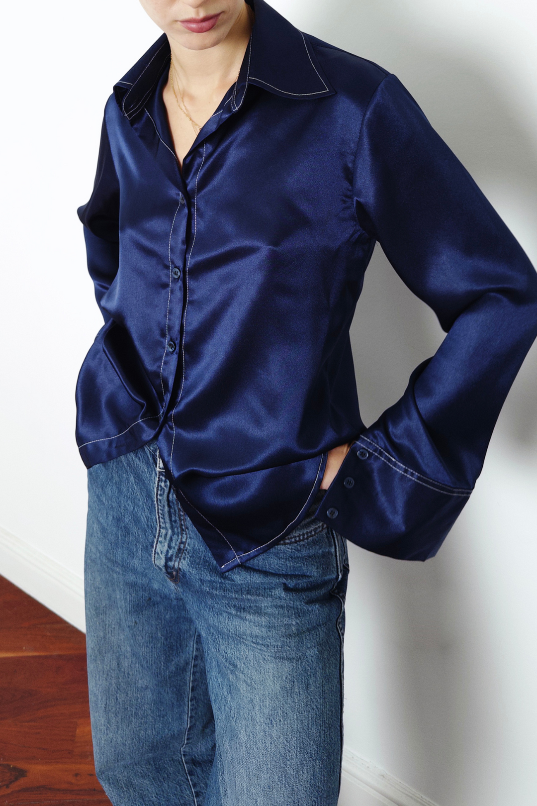 navy silk shirt with white contrast stitching worn in London