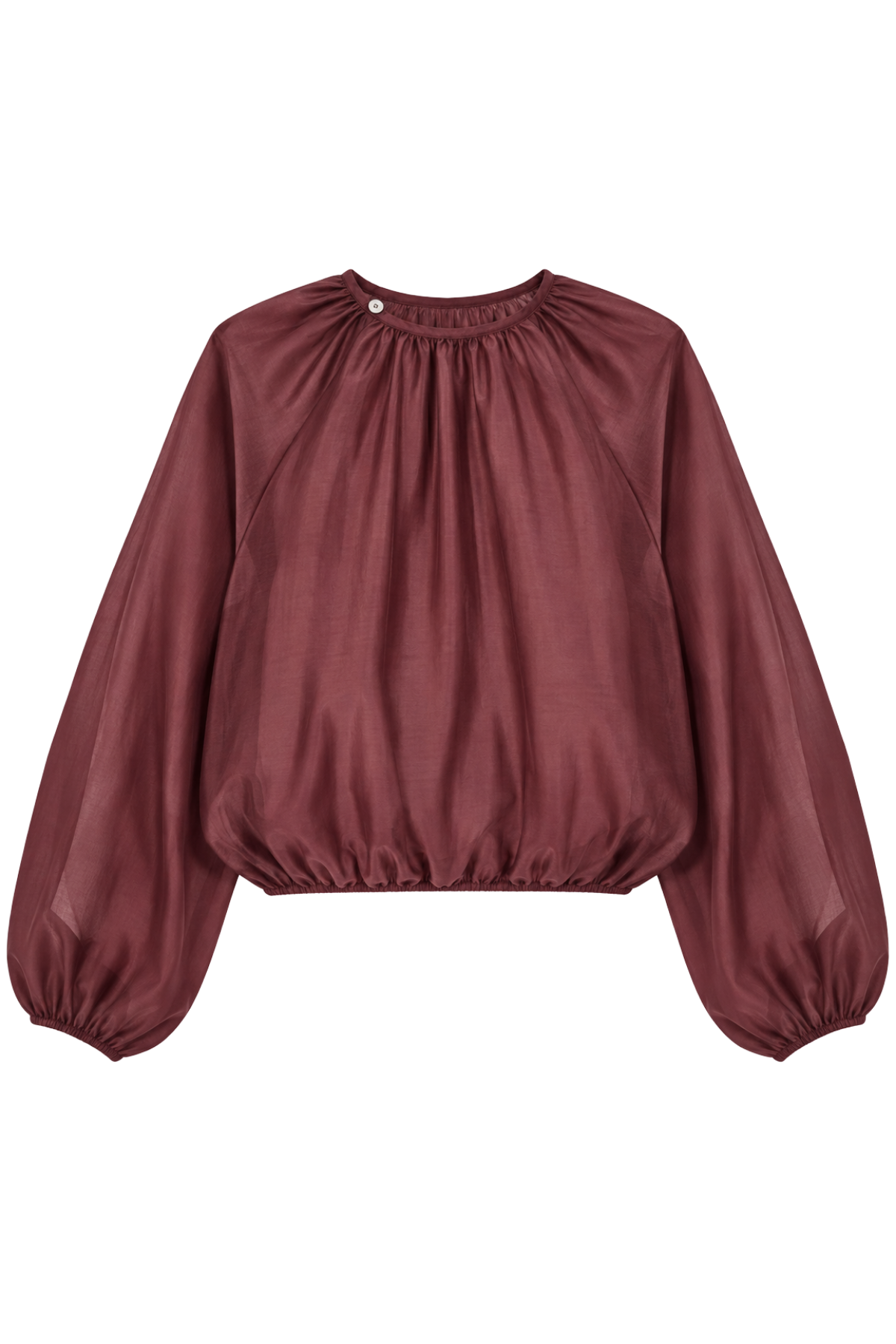 A woman modeling a long-sleeve blouse with a gathered, balloon-style sleeve and a round neckline in a deep burgundy color, paired with dark charcoal trousers, against a light gray studio background.