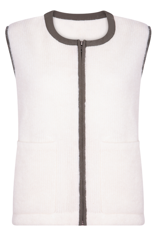 cream mohair gilet with green goretex zip worn by a size UK 8 girl in London