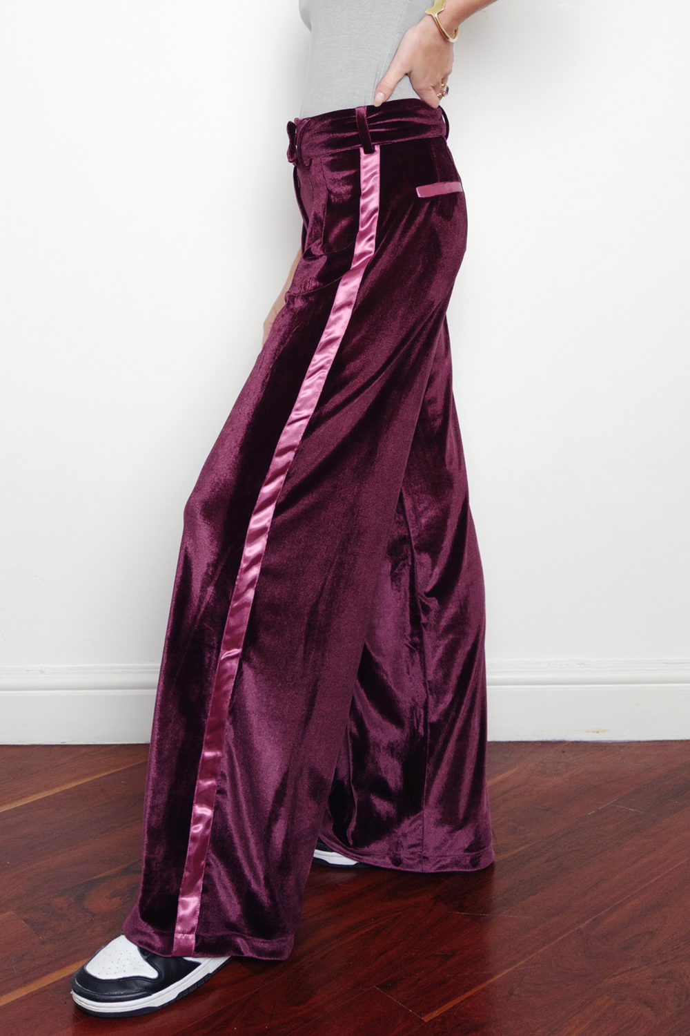 purple wide leg velvet trousers with silk detailing