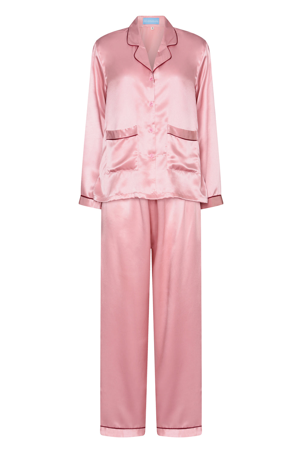 Pink silk matching pyjamas with red piping, worn in London